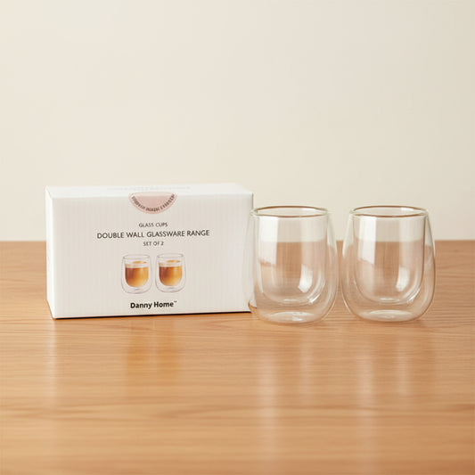 Two clear double-walled glass cups displayed next to their white Danny Home product box on a plain white background.