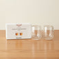 Two clear double-walled glass cups displayed next to their white Danny Home product box on a plain white background.